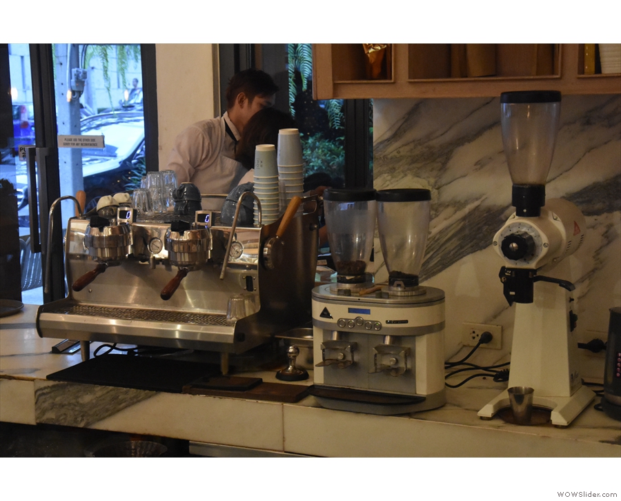 The two-group Synesso and its twin grinders (house + decaf) are at the back.