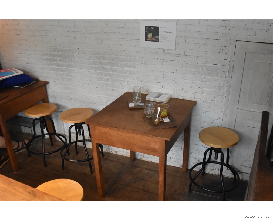 ... and a pair of two-person tables against the back wall.