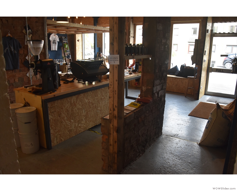 The view from the far end of the passageway, towards the counter and seating beyond.