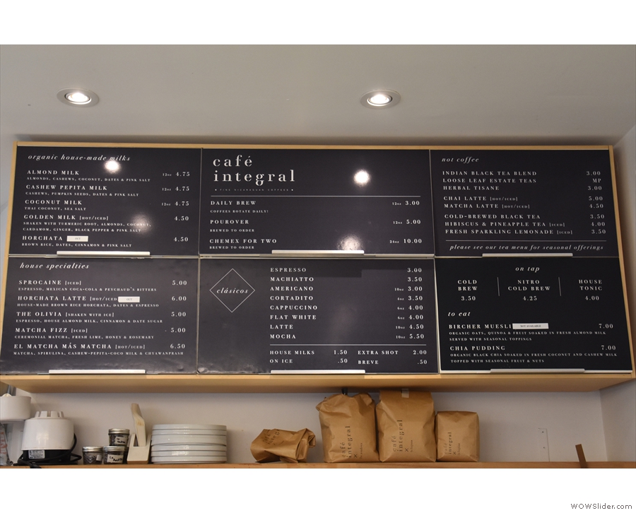 The main menu, with prices, is on the wall above/behind the counter.