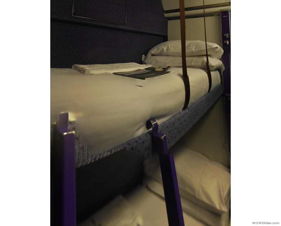 The top bunk, with some straps, presumably to stop you from rolling out in the night.