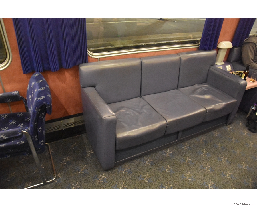 On board, and the first stop is the lounge car. Where else can you find sofas on a train?