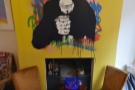 The chimp looks down from above the old fireplace, where you can play Connect 4.