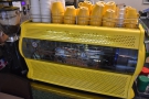 ... with this gorgeous, yellow, bespoke Conti espresso machine with a cut-away panel.