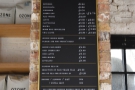 ... while the coffee menu is on the chimney breast to the right of the counter.