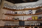 There is more coffee, and coffee kit, on the walls behind the counter.