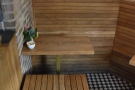 The seating in more detail: there's a continuous, built-in wooden bench...
