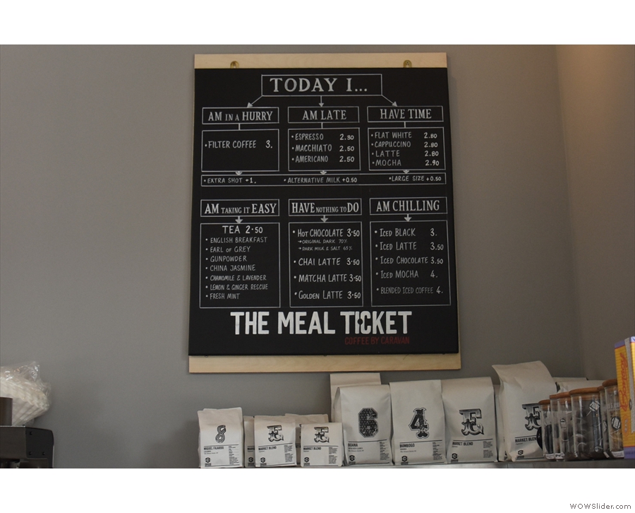 A handy flow-chart menu on the wall behind helps you order your coffee and other drinks.