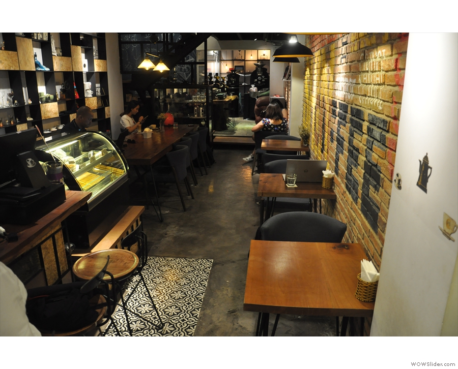 At the end of the counter, a row of four two-person tables runs down the rght-hand wall.