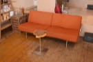 ... and, facing that, a big, orange sofa.
