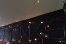 ... which spell out 'Monks' in light bulbs and copper piping!