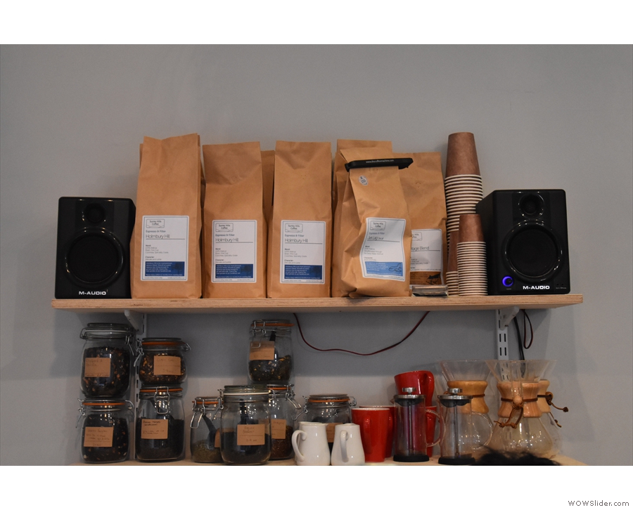 .. with bags of the current coffee on the shelves above.