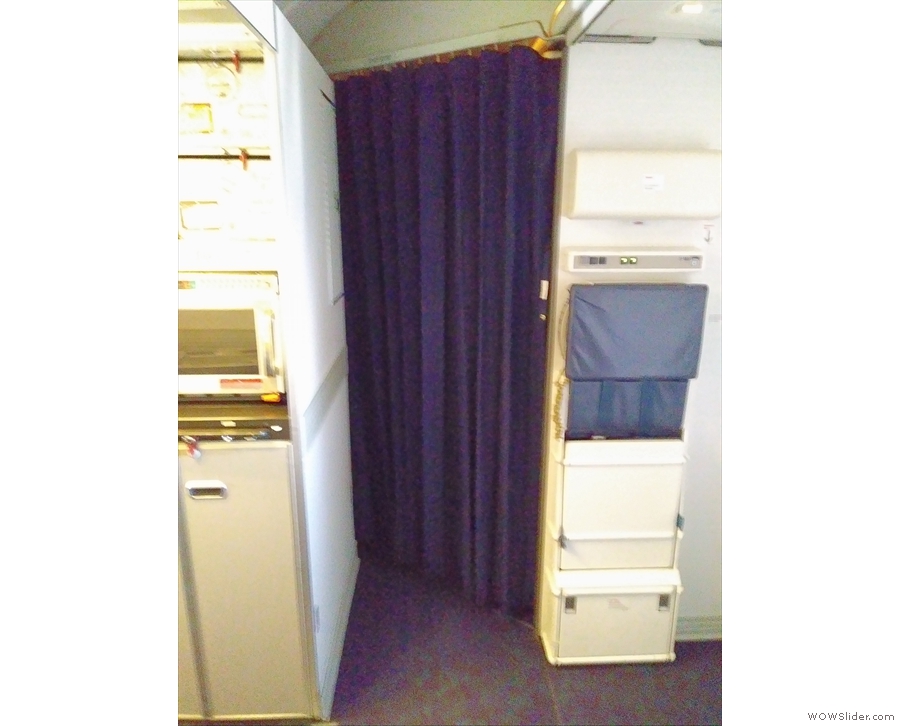 ... which is screened off by a curtain during flight.