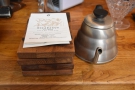 The wooden trays are used for serving, with the info cards handed out with the coffee.