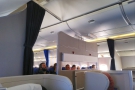 In preparation for landing, the curtains are drawn back between the different cabins.