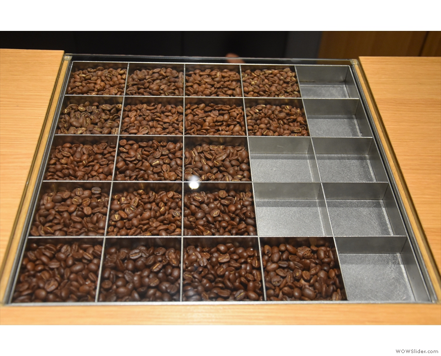 The beans are arranged in bins by roast profile, getting darker the further down you go.