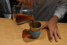 Once the brewing is finished, the coffee is poured into the pre-warmed cup.