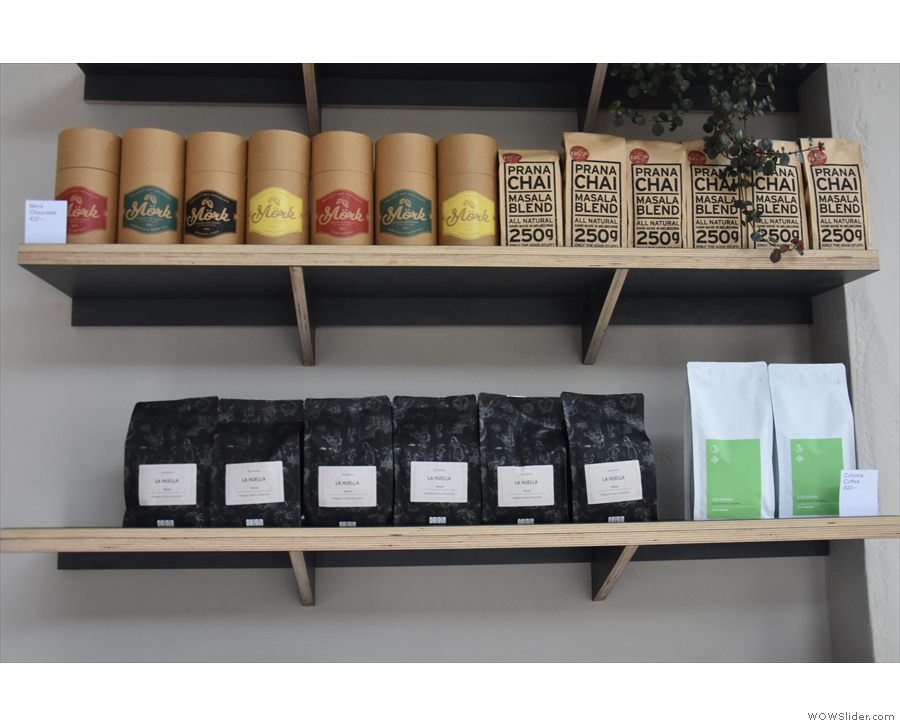 The top shelf has hot chocolate from Australia, plus chai, while the shelf below...