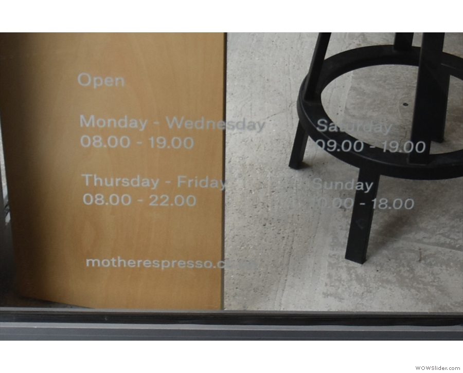 The opening times are on the bottom of the door, visible, but not very prominent.