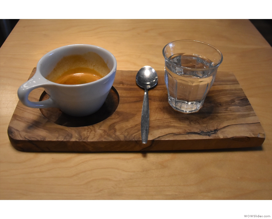 ... the Ethiopian single-origin, served on a wooden tray with a glass of water.
