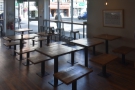 There's also a cluster of fixed, wooden tables with short, wooden benches.