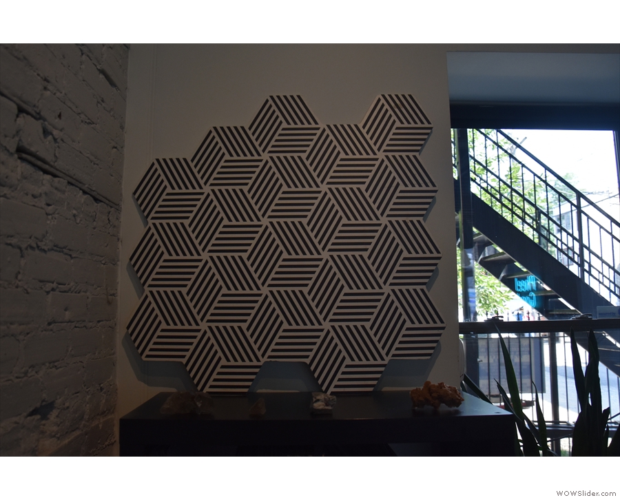 ... while what I took to be a hexagon pattern on the wall is, in fact, the cube logo again.