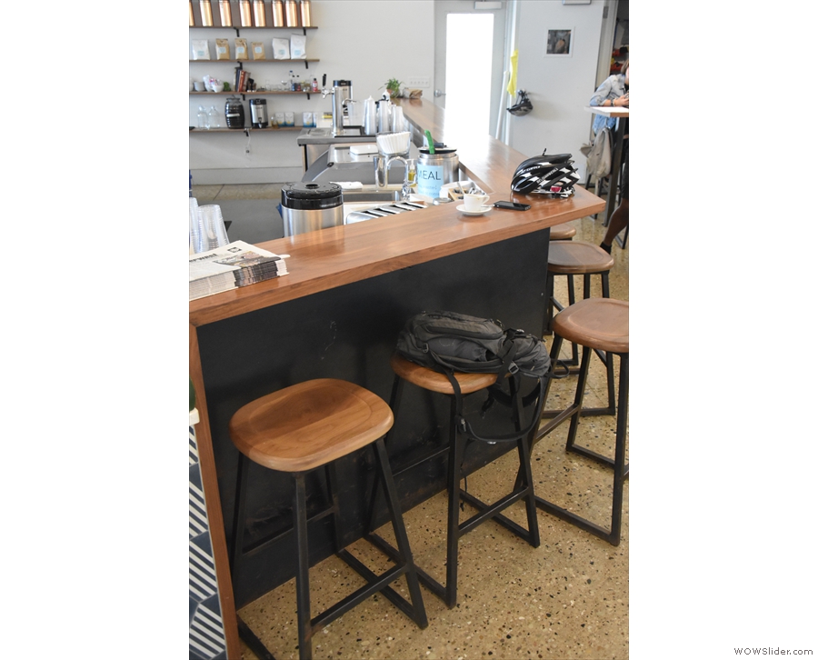 There's more seating if you go around behind the counter, starting with these three stools.
