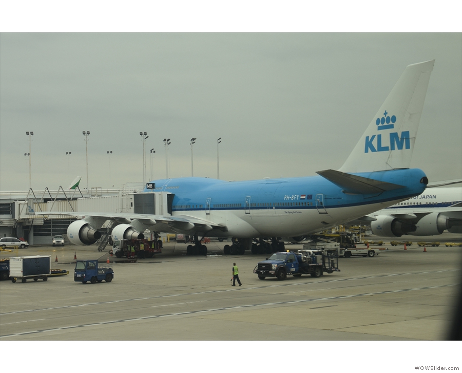 A KLM Boeing 747-400 is next door at Gate M8..