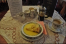 A caffetiere of coffee and apple pie, smoothered in custard. Home comforts at Anna's Tea Rooms, Conwy