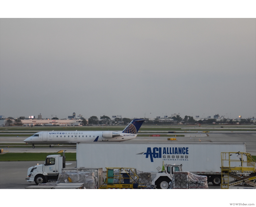 If you want an idea of size, here's a United Bombardier CRJ-200 next to a large truck...