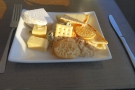 Knowing that I would be eating later, I helped myself to cheese and biscuits.
