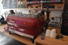 However, the lovely red La Marzocco GB5 espresso machine  is still there...