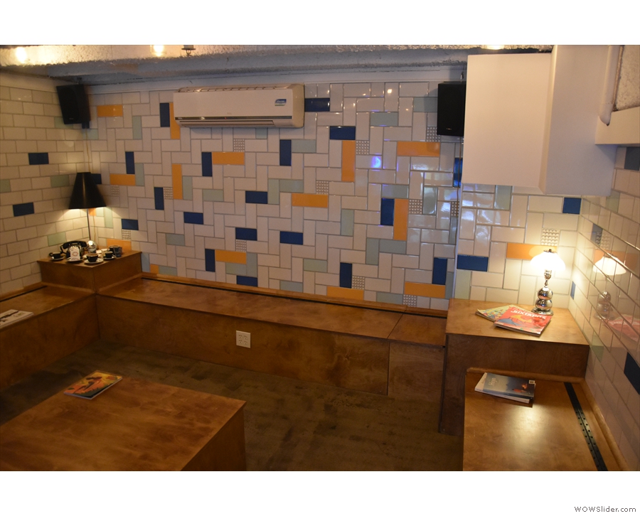 ... while the back wall has multi-colour tiling and a generous helping of power outlets.