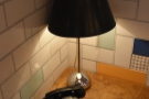 This one has a lamp and an old-fashioned rotary dial telephone.