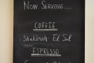 The coffee choices are chalked up on the board on the right-hand wall.
