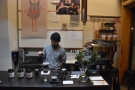 Barista and head-roaster, Yuuki, at work making pour-over at the counter.