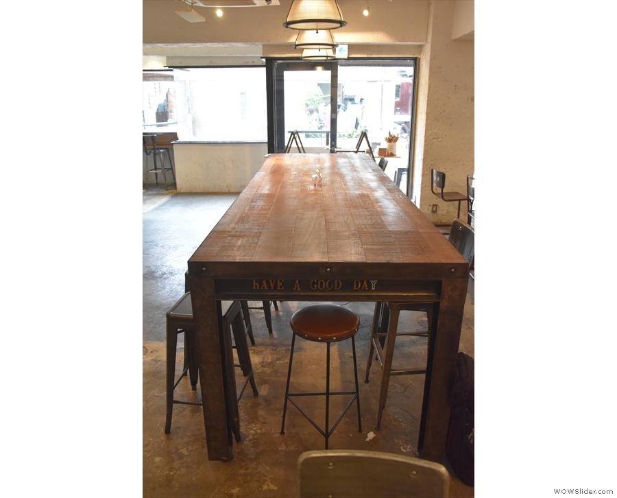 The communal table dominates the centre of the room, no matter how you look at it.