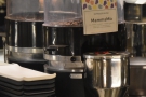 ... while on the other side of the espresso machine, there's a fourth grinder with the...