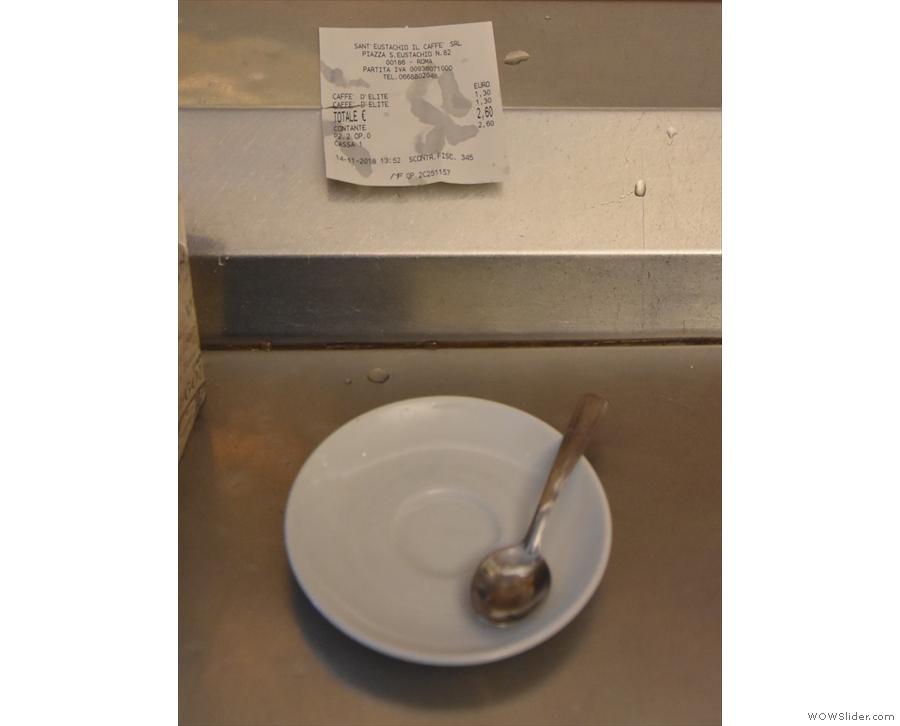 The promise of espresso: an empty saucer is placed in front of you on the counter...