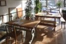 These two large tables are on the right-hand side, with a four-person table at the back...