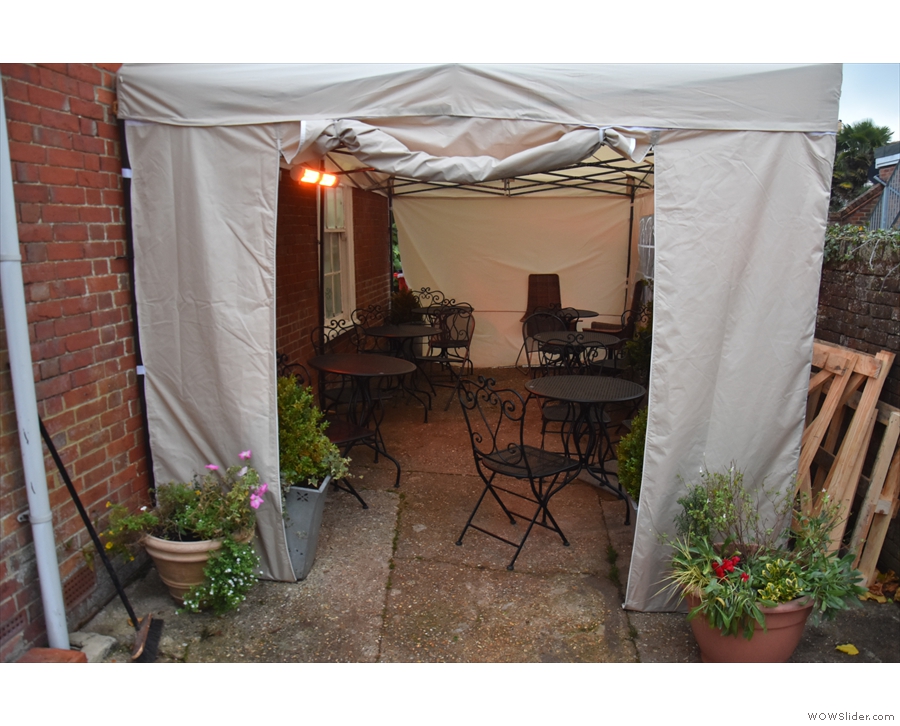 ... it's just sheltering (perhaps only for the winter) in this gazebo at the back.