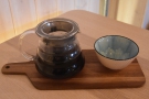 A better shot of my coffee, served on a wooden platter, a gorgeous bowl on the side.
