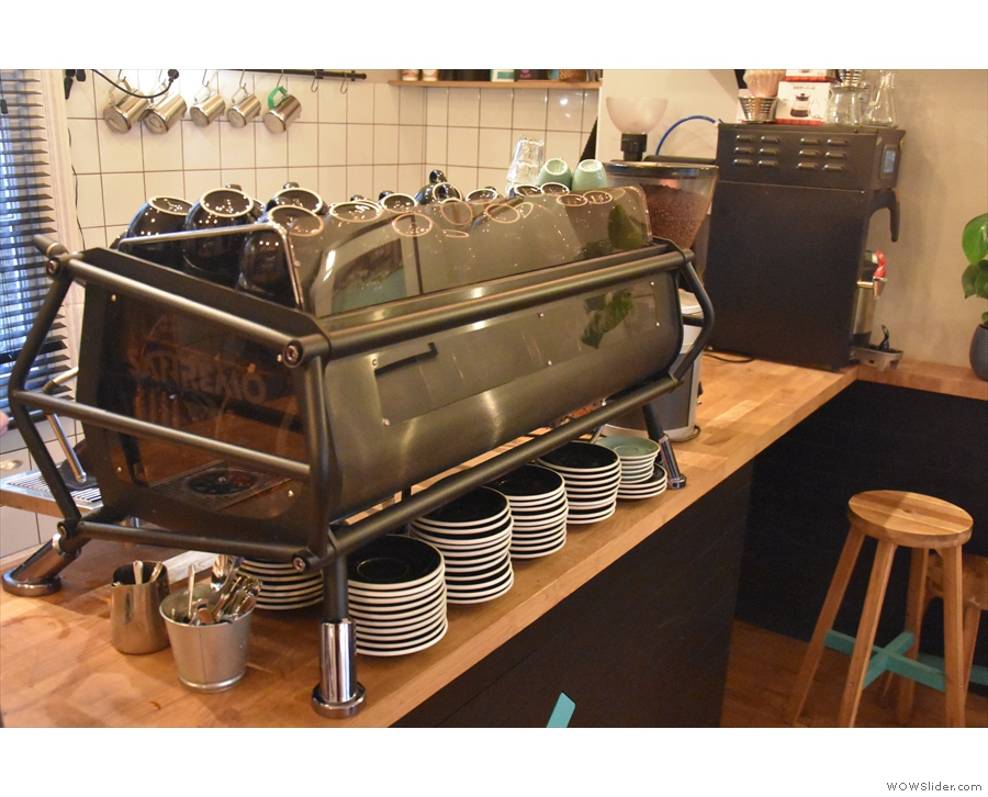 The espresso machine, an impressive-looking Sanremo Cafe Racer, is in the middle...