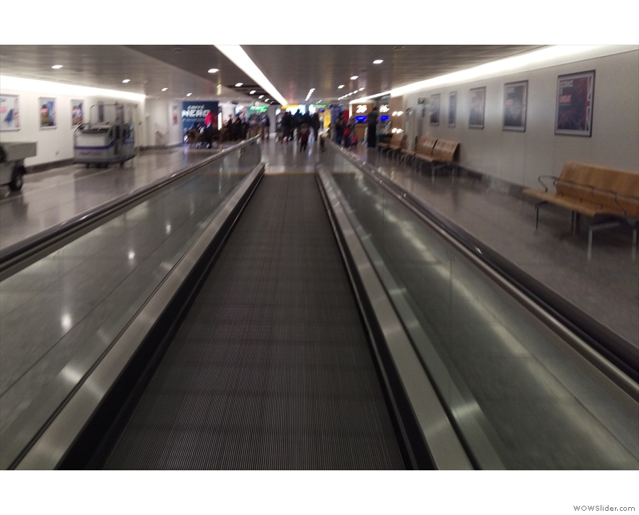 Gate 40 is at the far end of Terminal 3. This is just one of three long, moving walkways...