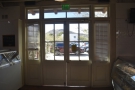 ... while over in the back wall, these double doors lead to the parking lot.