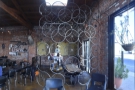 There's more seating beyond this transparent wall of bicycle wheels.