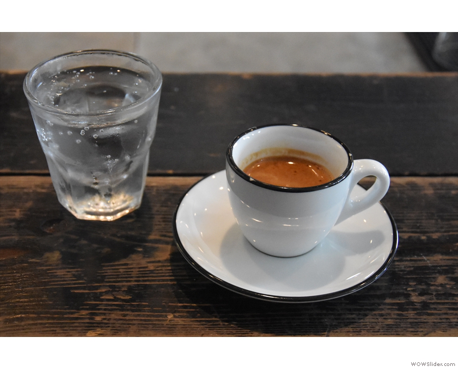 My espresso, served with a glass of sparkling water...