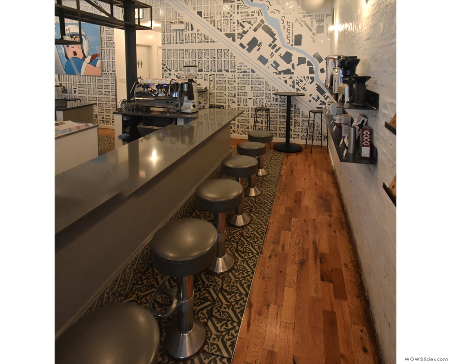 There's seating down either side of the counter in the shape of eight fixed stools.