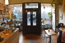 Inside there is a seating area to either side of the door, a table on the right and...