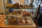 ... passing the aforementioned cakes, which are at the front of the counter in a glass case.